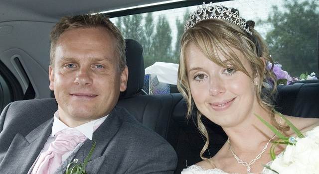 image of a wedding couple being driven in an S class Mercedes wedding chauffeur car