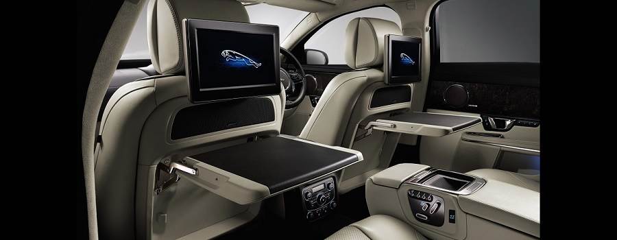 interior of a jaguar xj with folding tables