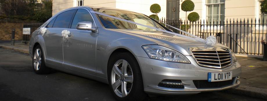   Silver Mercedes wedding car