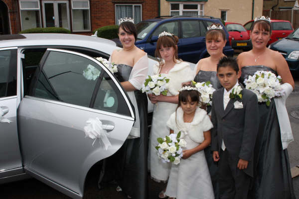 images of a bride and her family standing beside their mercedes wedding chauffeur car