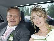 image of a wedding couple inside a chauffeured wedding car